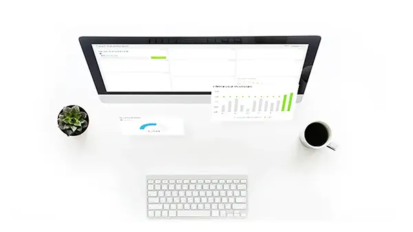 A KPI Report floating above a computer monitor